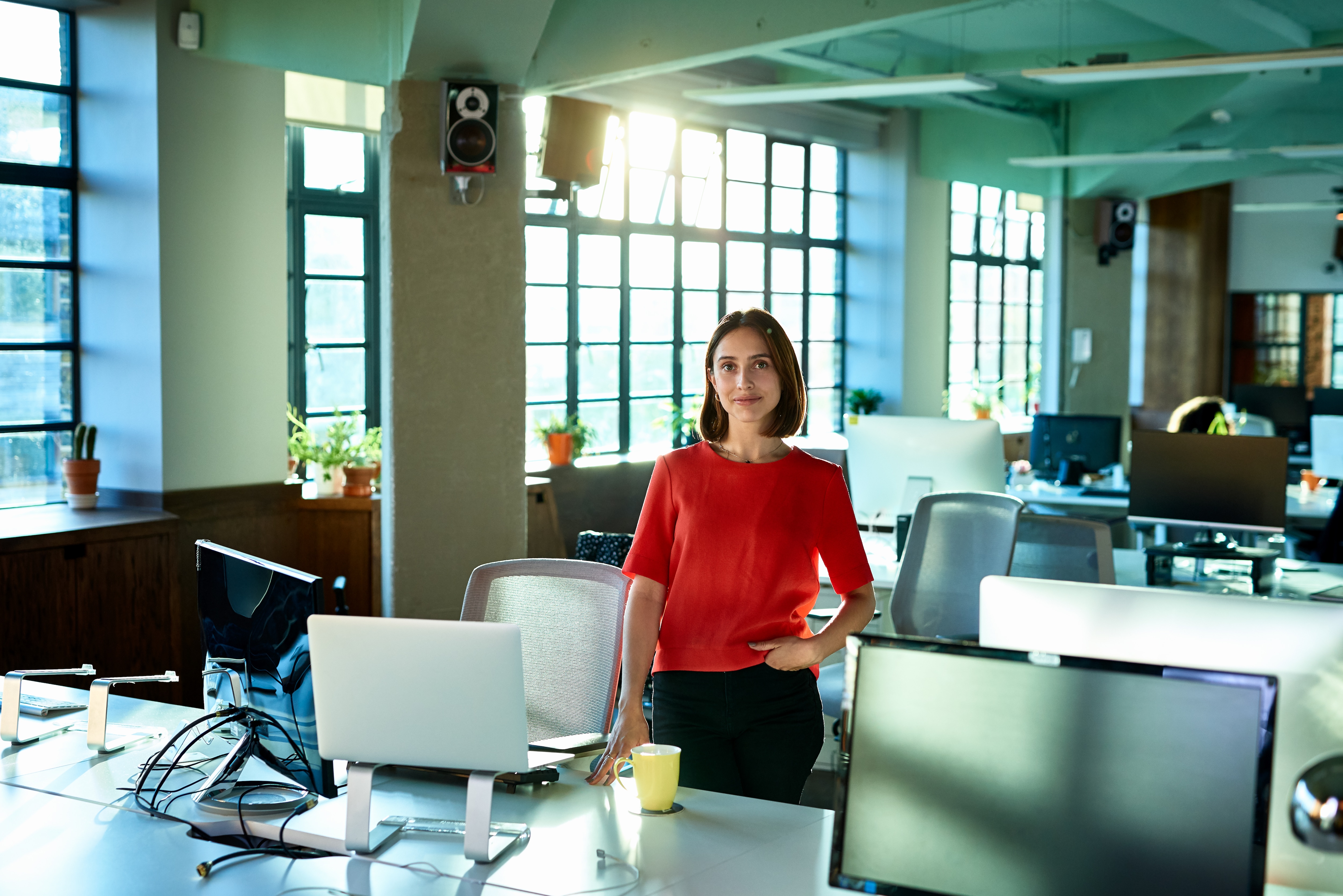 Woman in an office looking at the camera