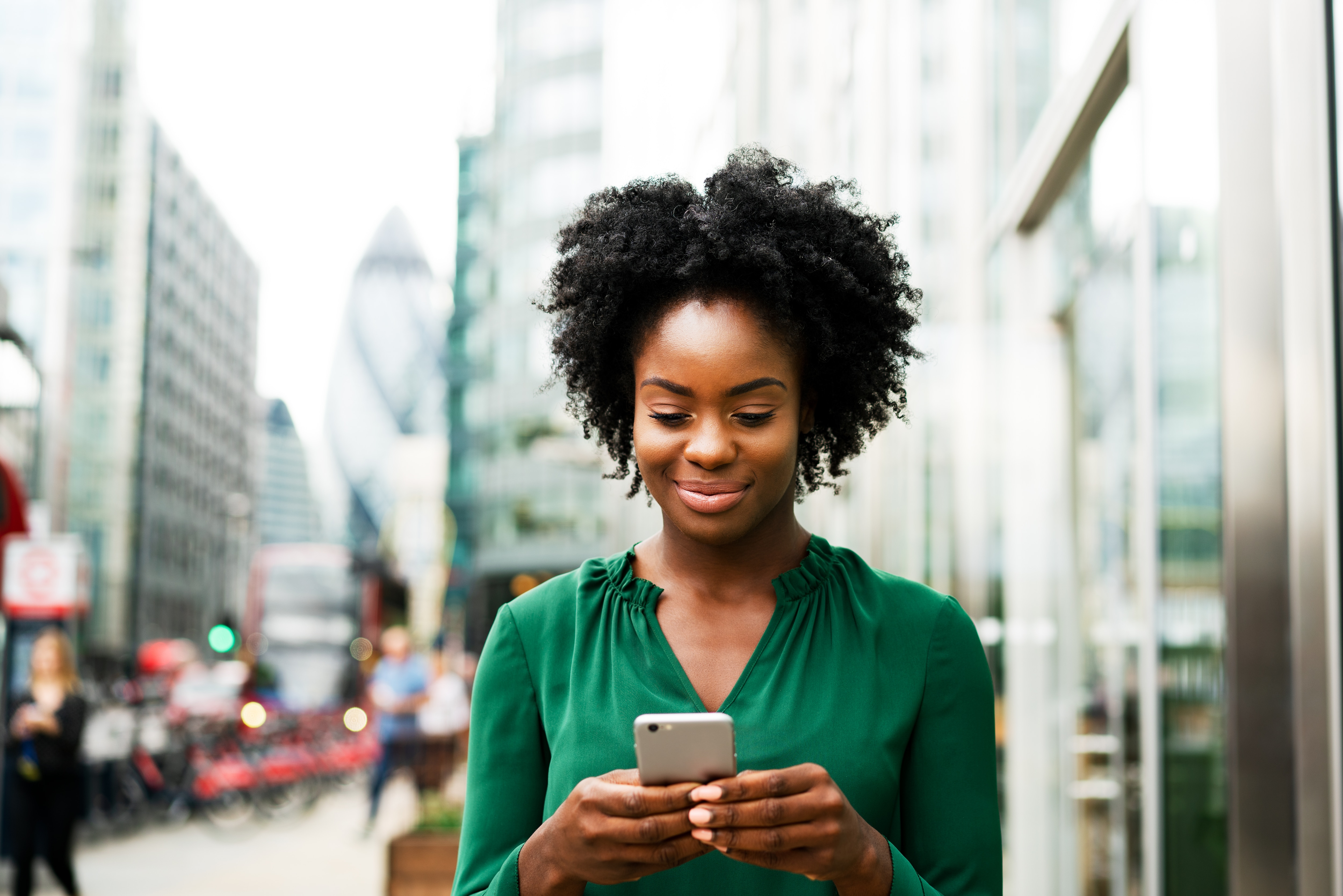 a woman using typing on her phone 