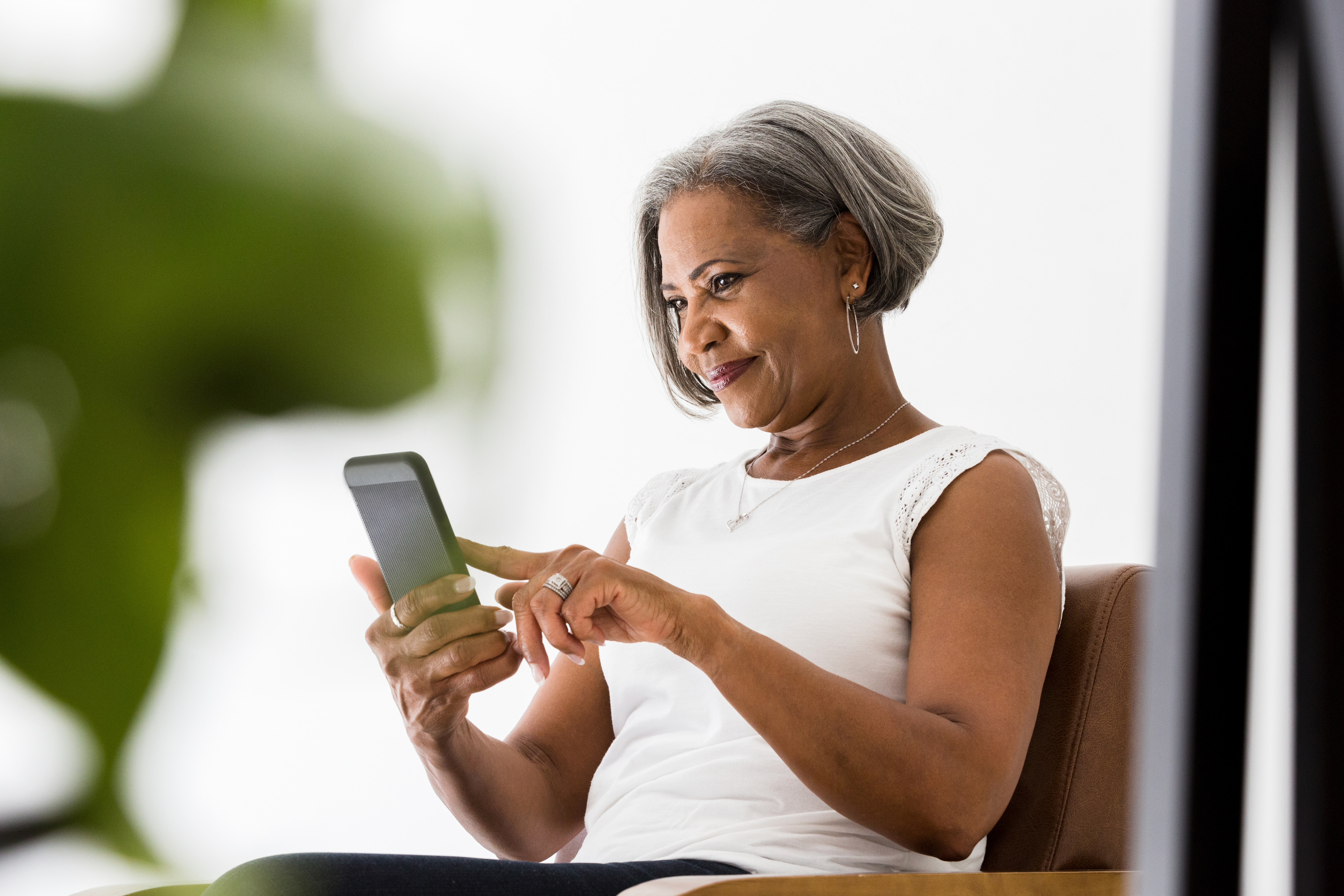 Woman smiling using phone 