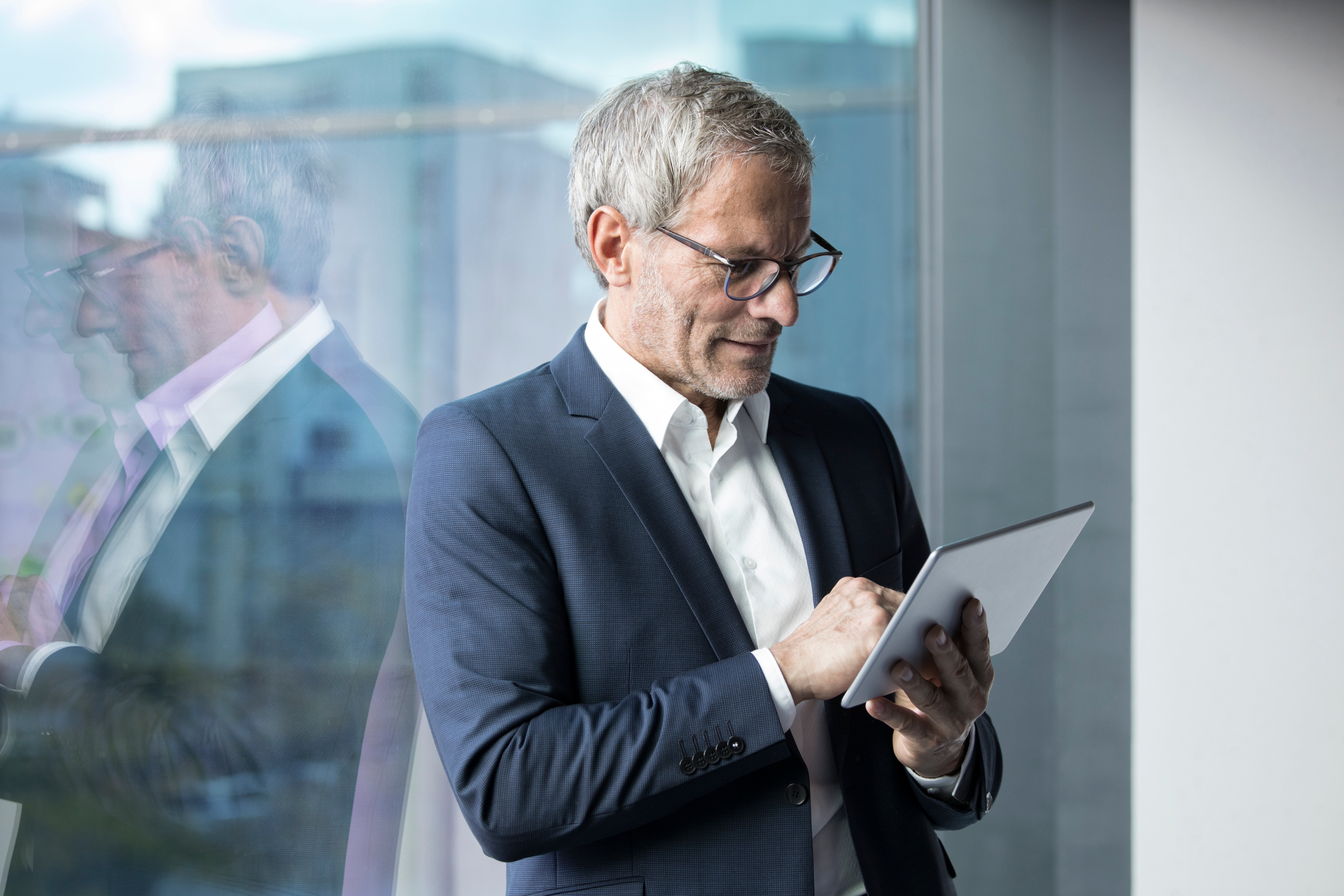 a businessman looking at his digital device