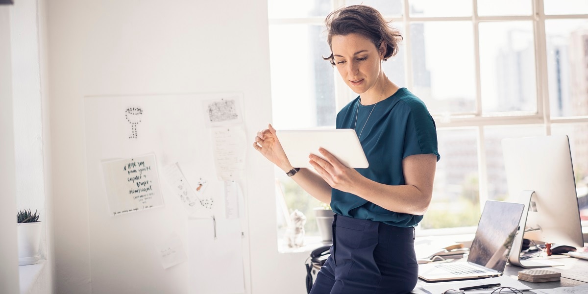 A businesswoman reviews a document